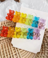 Add a splash of candy-colored cuteness to your hair with this playful French barrette! Six adorable gummy bears line up in perfect rainbow formation, bringing whimsical charm to any hairstyle.